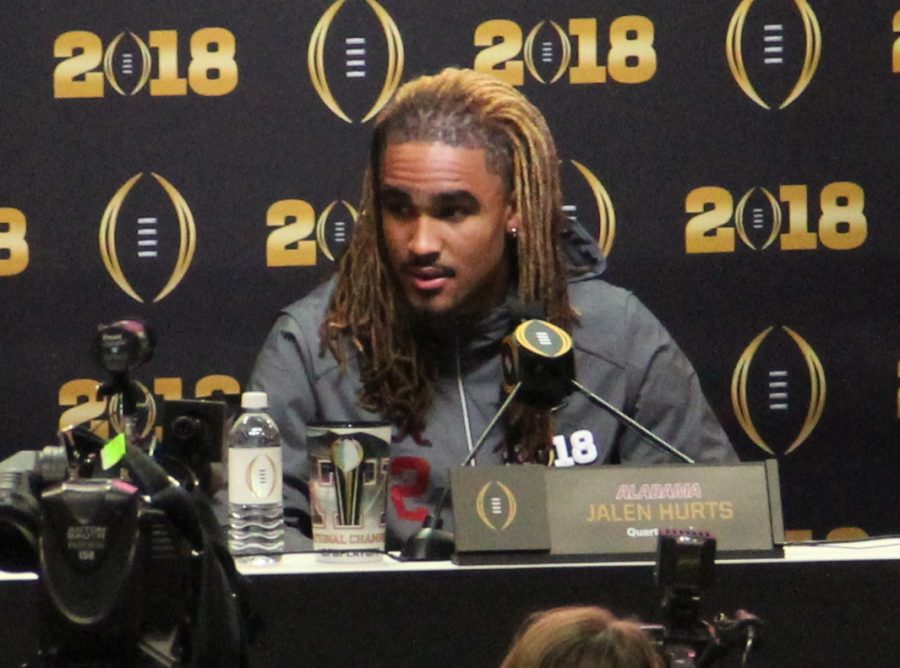 Hurts answers questions at media day for the College Football Playoff in 2018.