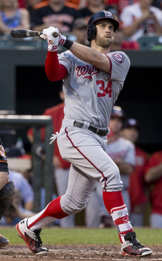 Harper watches a homerun with his old team, the Washington Nationals.