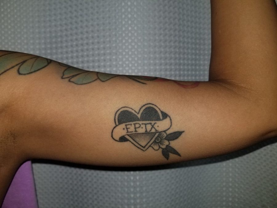Tattoos can convey a wide variety of messages, such as this El Paso heart tattoo on a womans bicep.