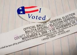 An I Voted sticker alongside a ballot shows the privilege of voicing an opinion, given to those 18 years and older.