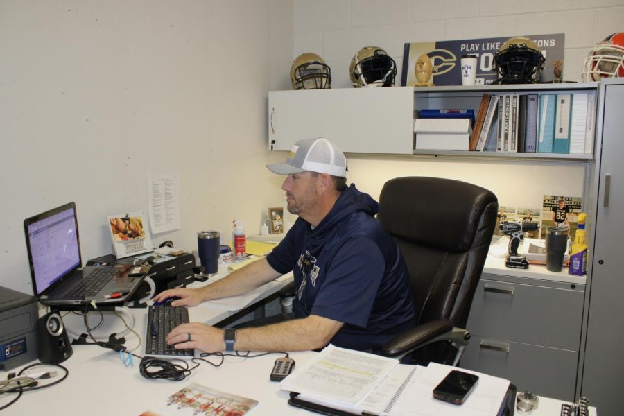 Coach Pry getting settled in his new office.